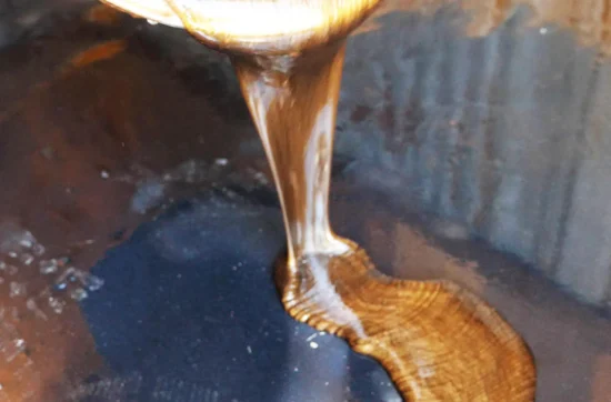 Epoxy being poured onto the floor